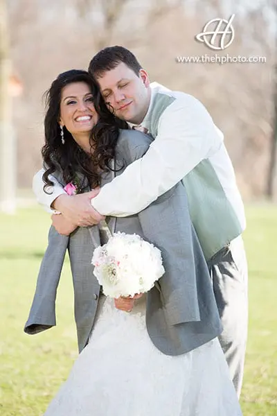 groom protecting the bride with his jacket