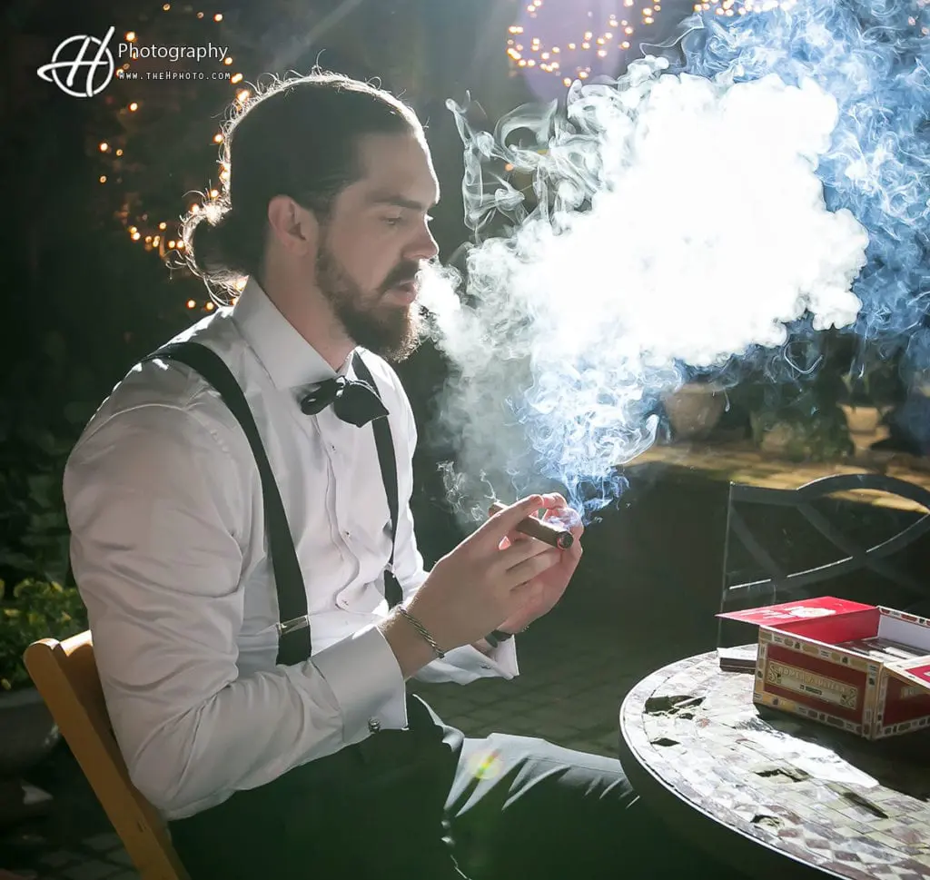 groom smoking cigar at a new leaf Chicago