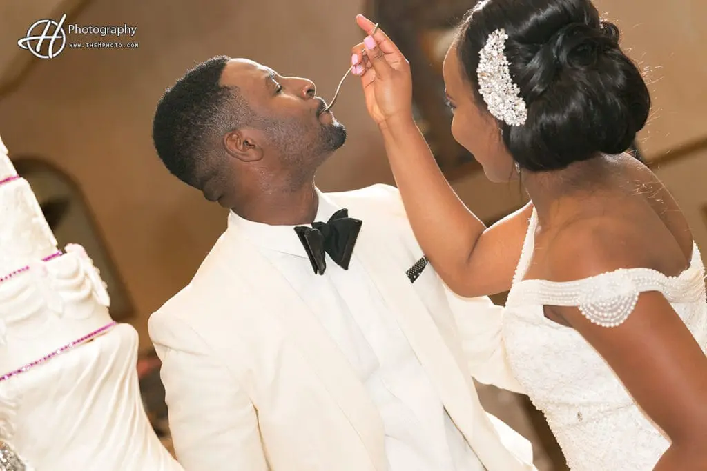 Bride feedin the groo,