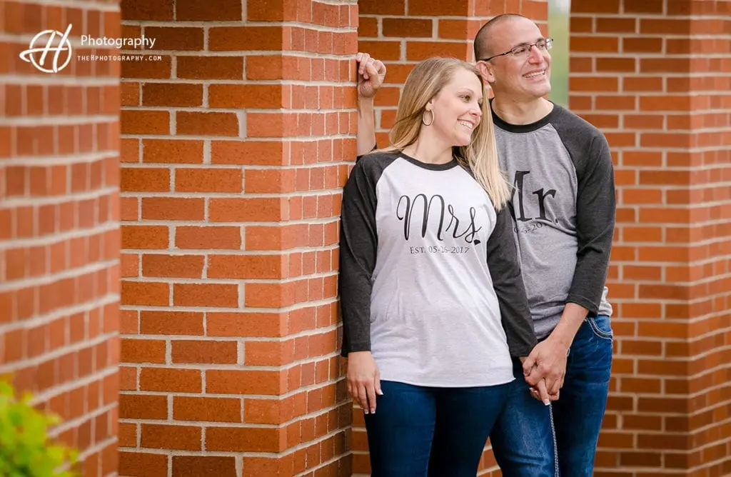 engagement photos by the brick wall 