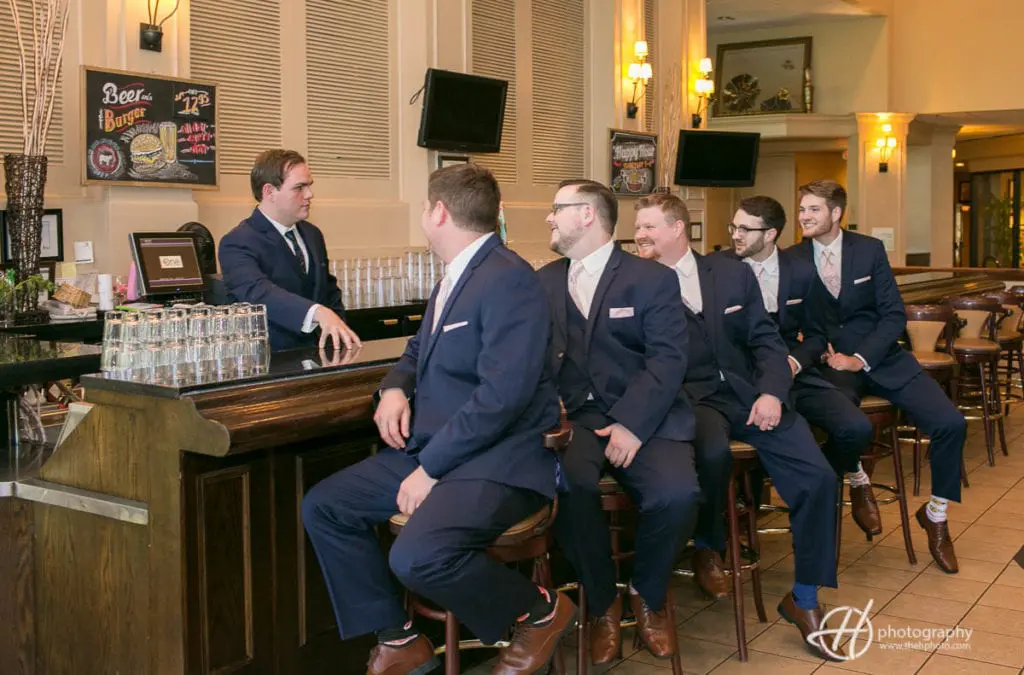 groomsmen at the bar