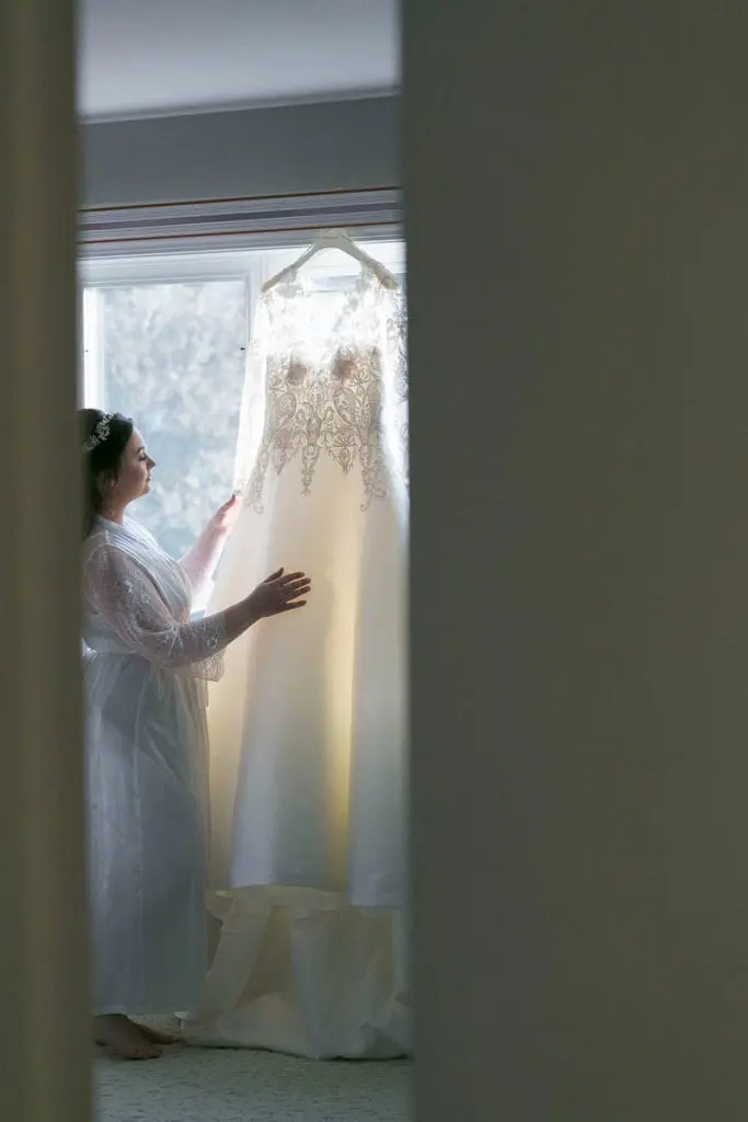 Kim looking at her wedding gown