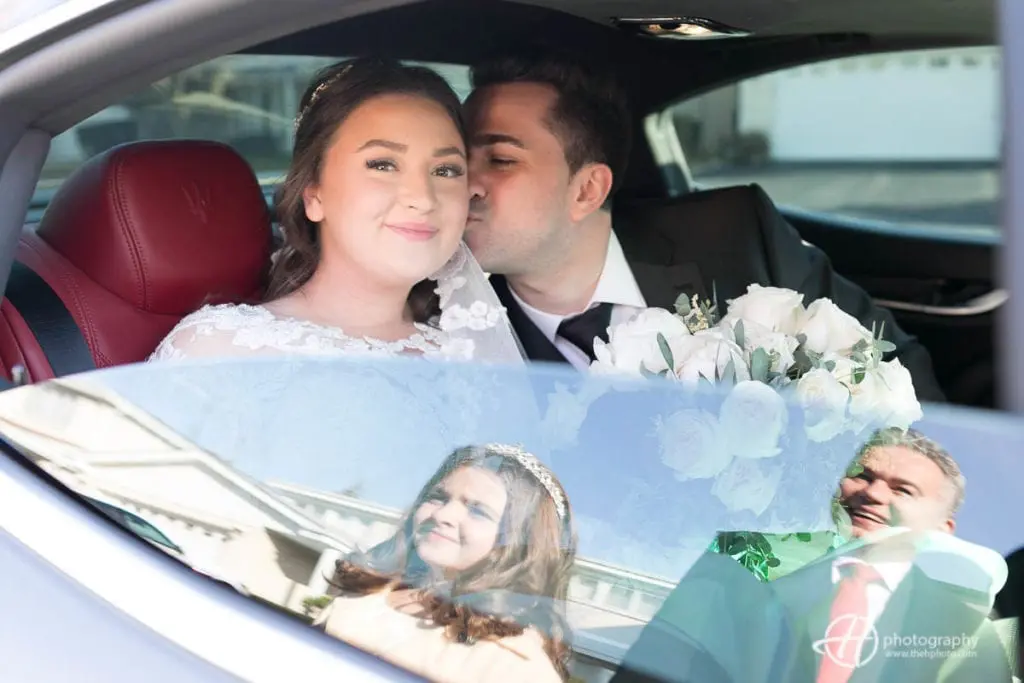 groom whispering to the bride