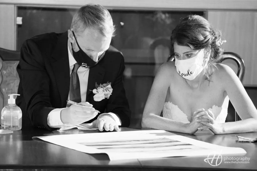 Signing Ketubah with masks on