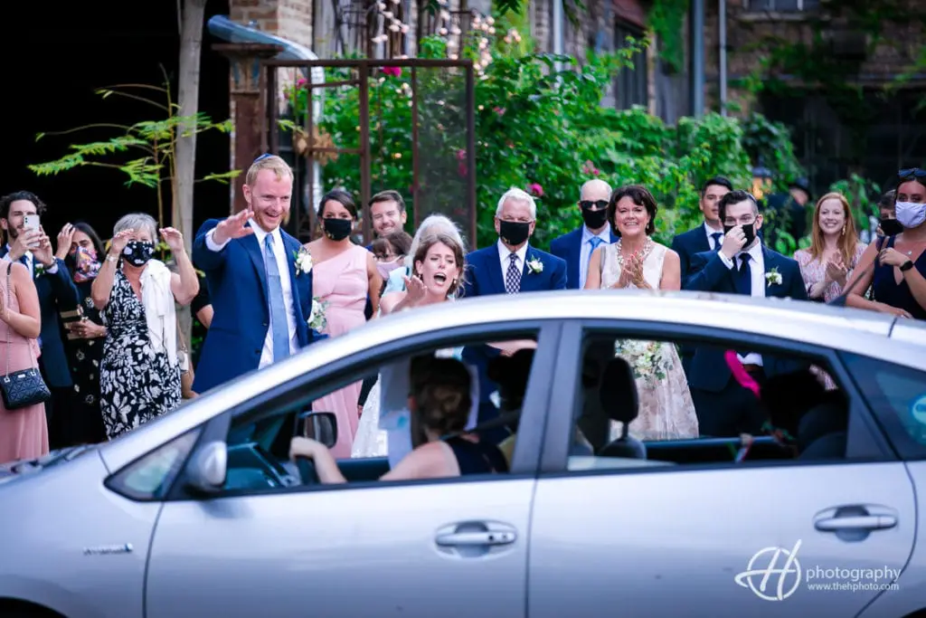 waiving to people passing by