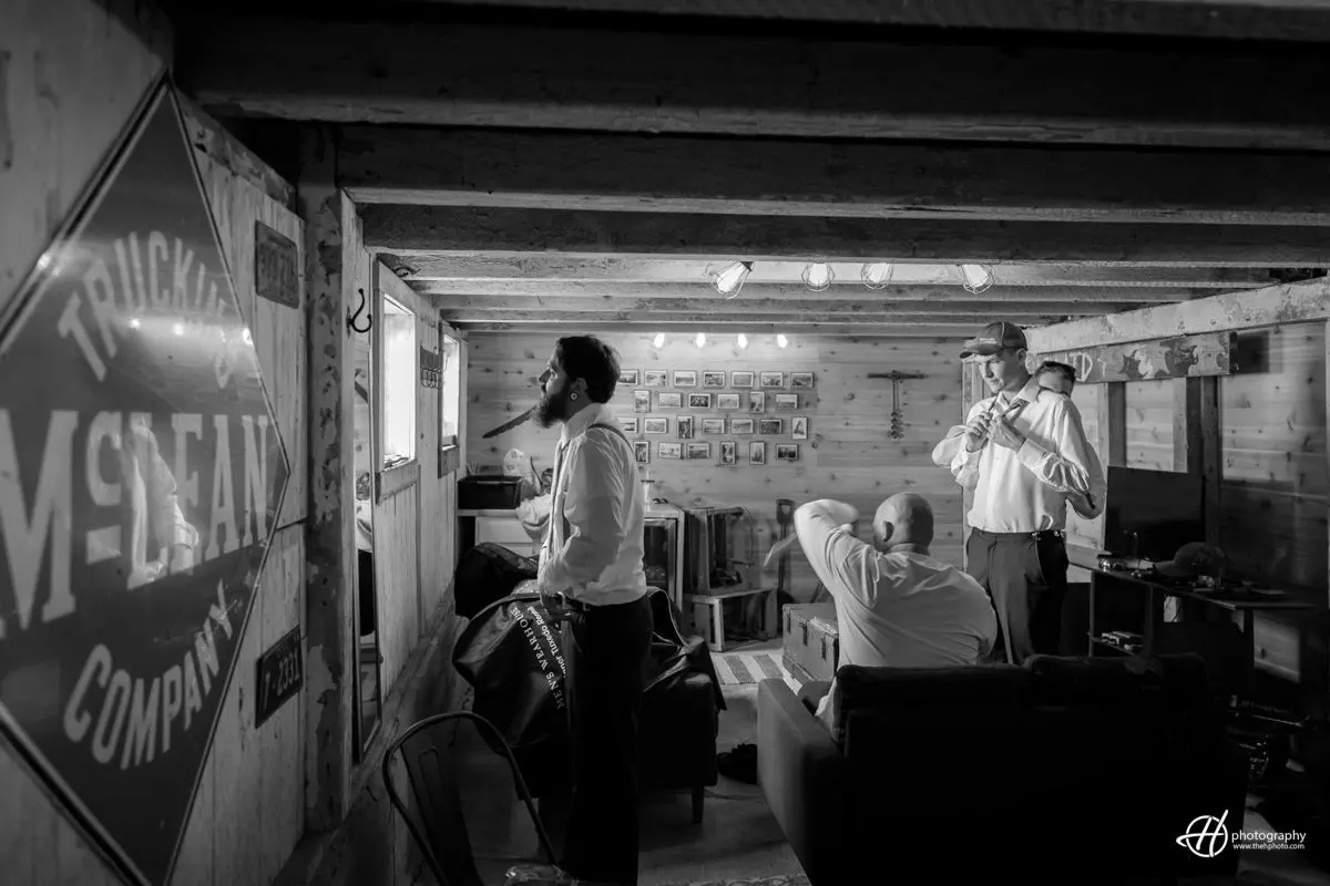 groom getting ready at the barn