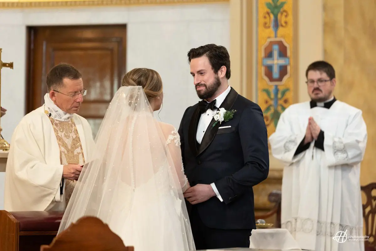 John saying his vows. rings exchange