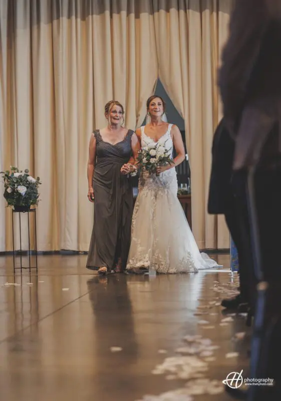 Kate walking down the aisle with her mom 