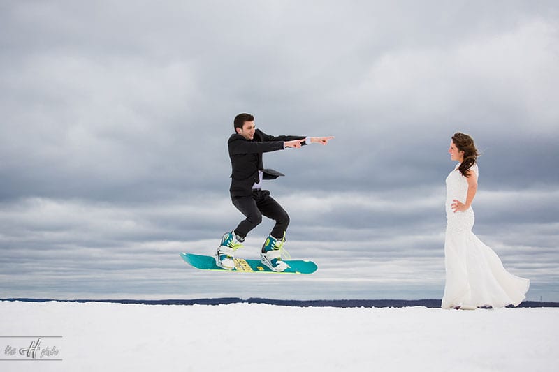 the 2 subjects took photos on snowboard