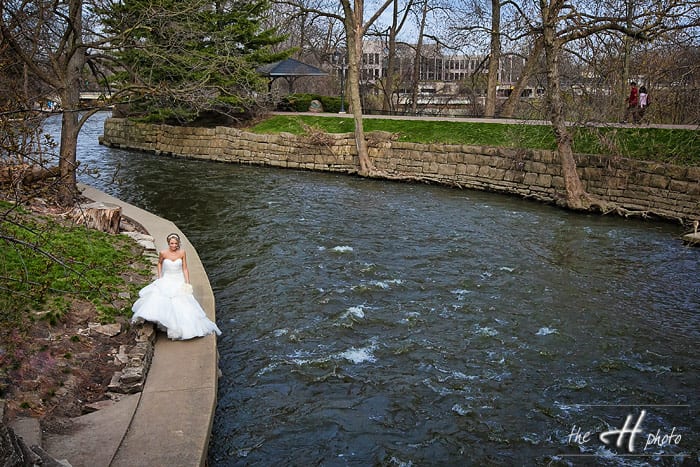 bride walks next to the river