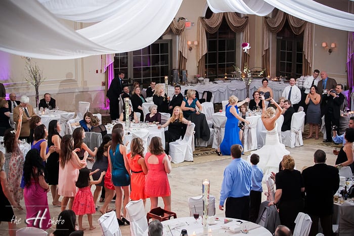 Emily tossing the bouqet at Venuti's