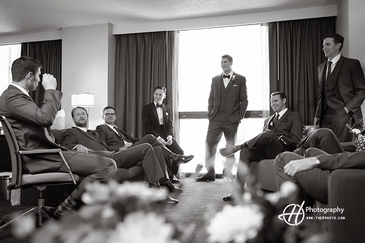 groomsmen chatting at Hyatt 