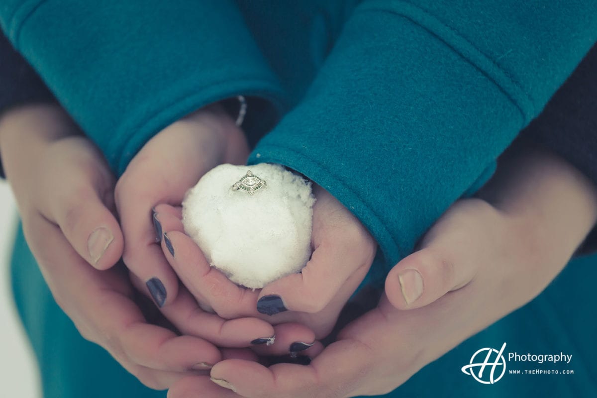 holding-engagement-ring-in-snowball