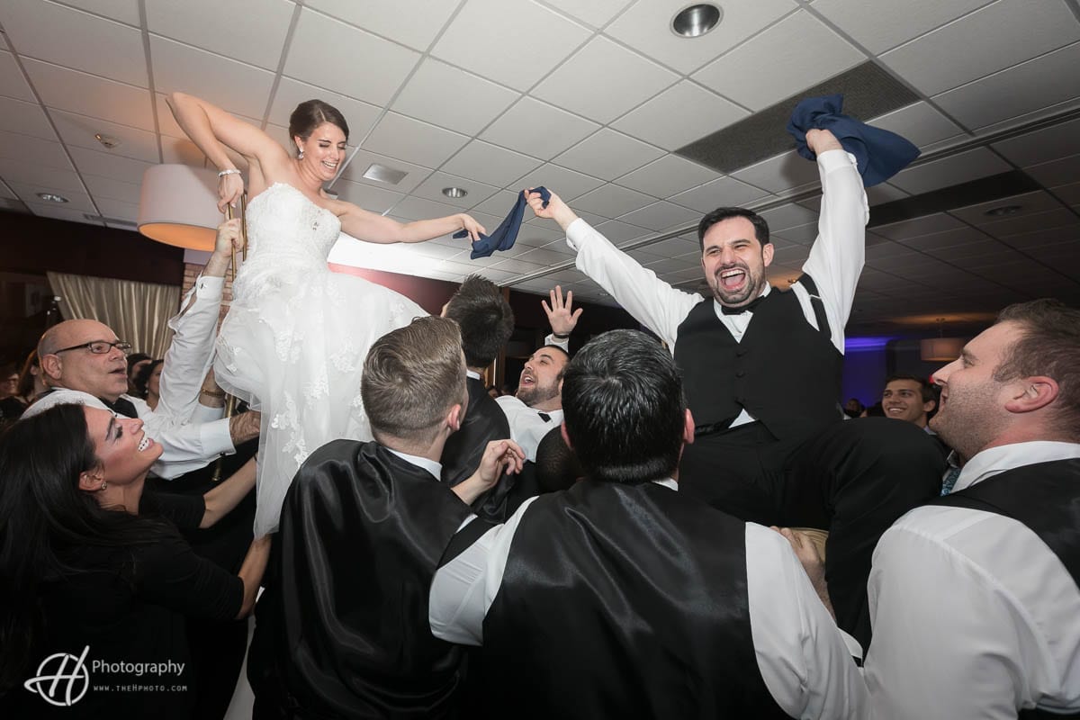 bride-groom-on-chairs-hora