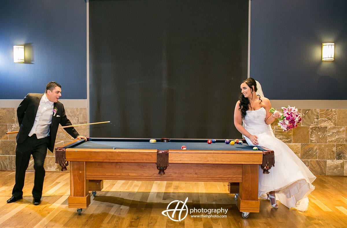 Bride and groom photo at pool table.