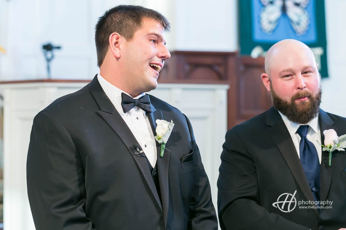 Groom crying while first seeing the bride.
