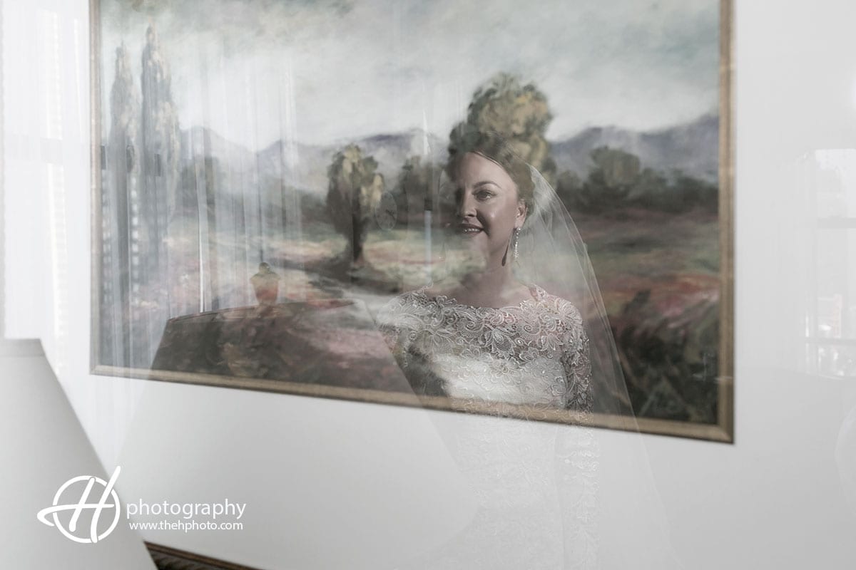 Bride reflection in the painting at the Drake