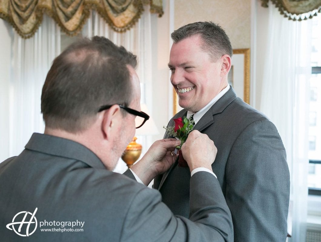 Groom getting help from his father in law.