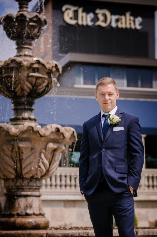 groom portrait by the Drake