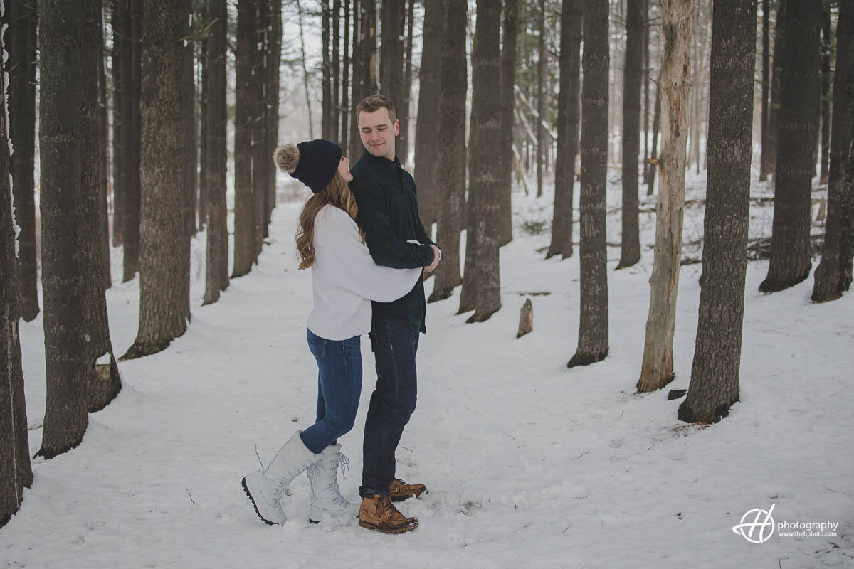 Image of Julia and Joseph standing in a pine forest, enjoying nature and each other's company